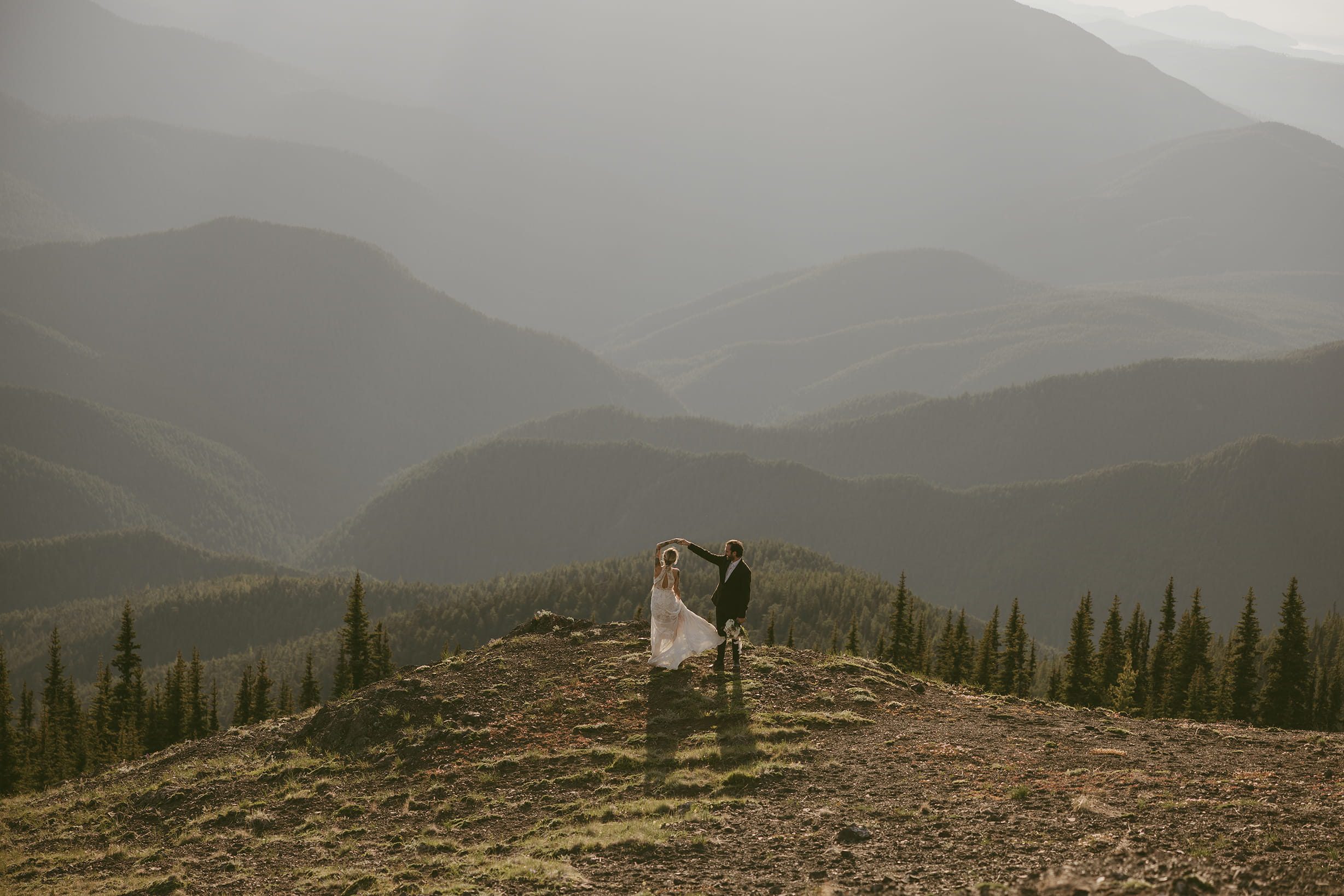 couple dancing in mountains pacific northwest on the olympic peninsula